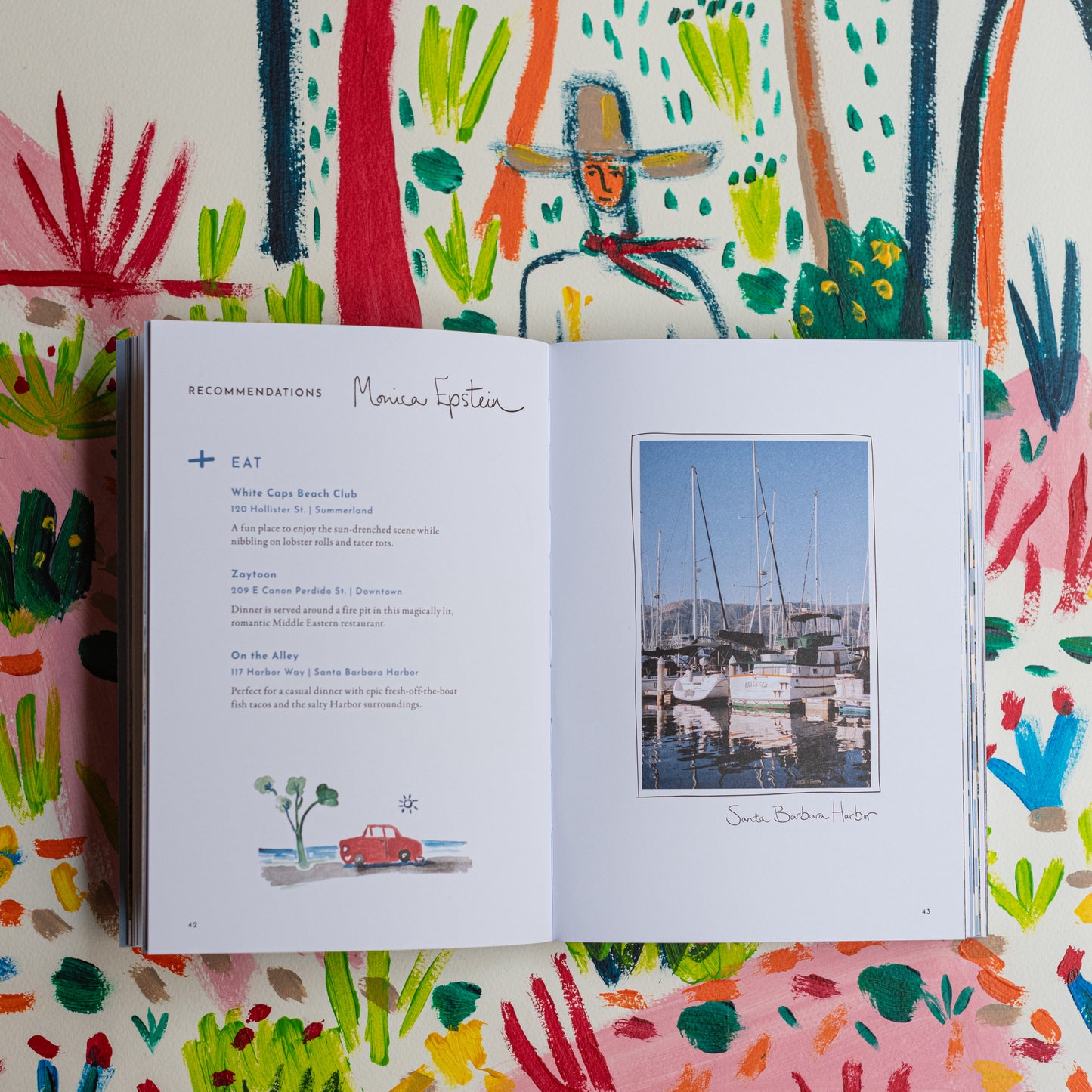 Image of the inside of the book Jaunt Journals Text and picture of the Santa Barbara Harbor.