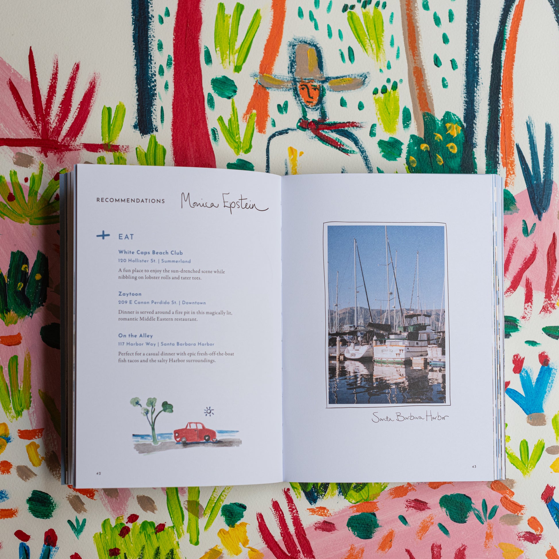 Image of the inside of the book Jaunt Journals Text and picture of the Santa Barbara Harbor.